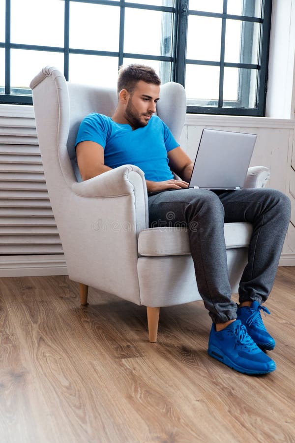 A man working with laptop.