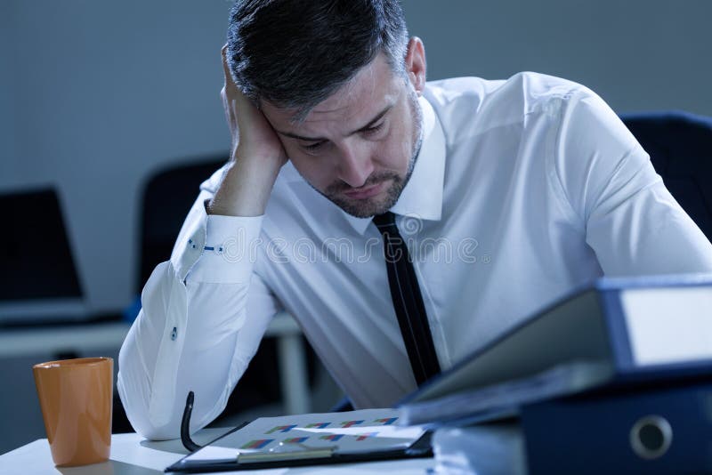 Man working late at the office royalty free stock photography Man working late at the office royalty free stock photography