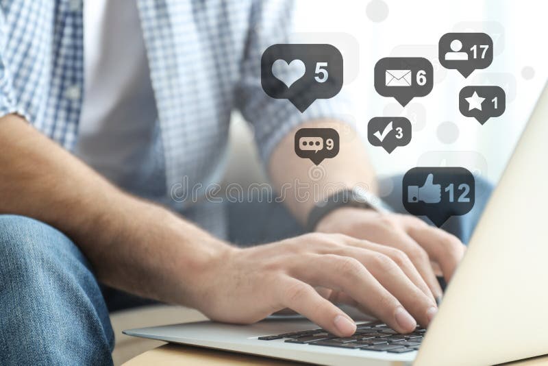 Man working on modern laptop at table, closeup. Social media marketing