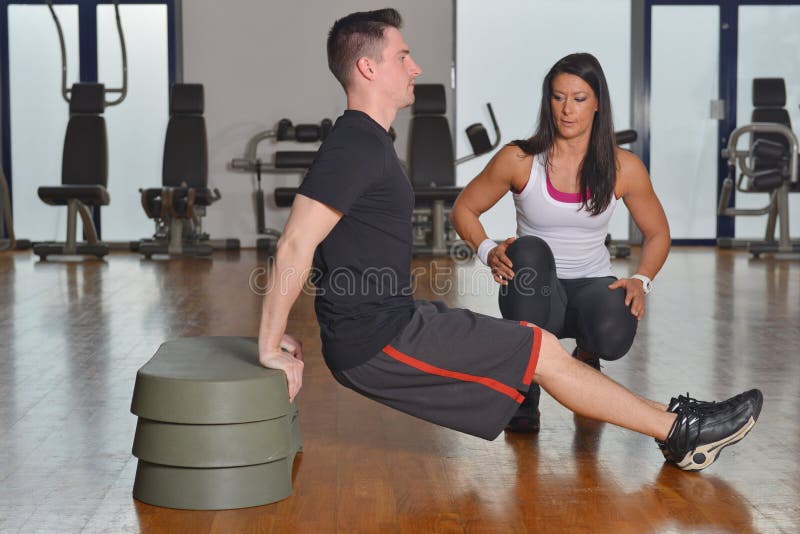 Man working out with his pesonal trainer stock photos
