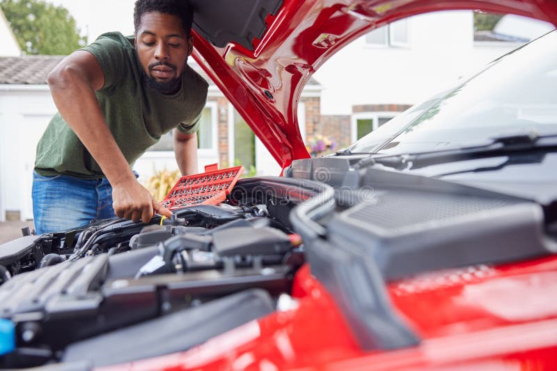 Man Working Under Hood of Car Fixing Engine with Wrench Stock Photo Image of engine,