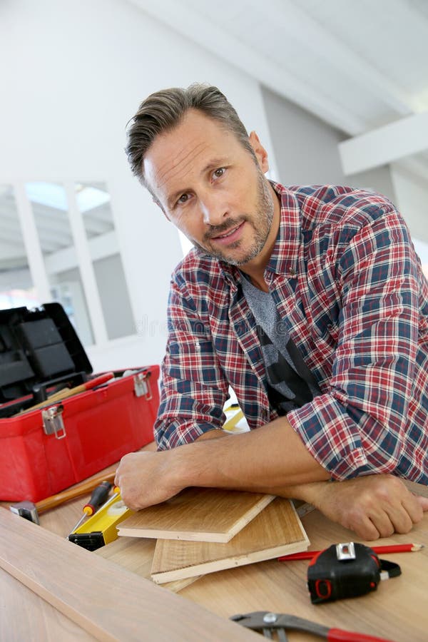 Man working on wood planks for home-improvement. Man working on wood planks for home-improvement