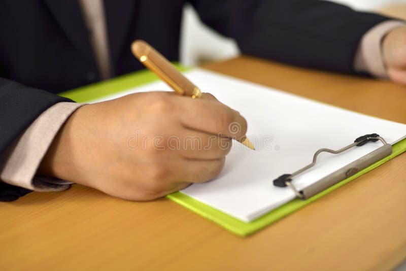 Man Writing On Blank Paper