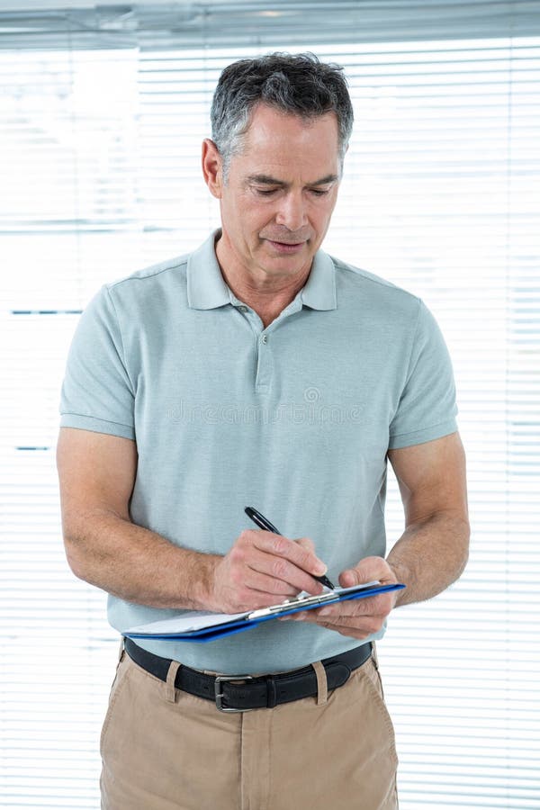 Man Writing Down Notes in Office Stock Image Image of male, workplace