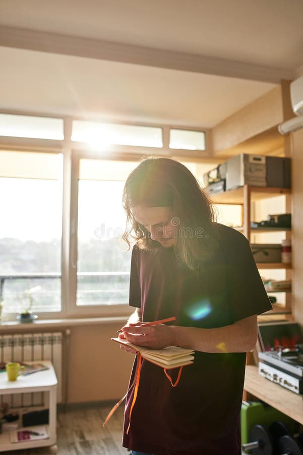 Male Songwriter Writing Text of New Song at Home Stock Image - Image of ...