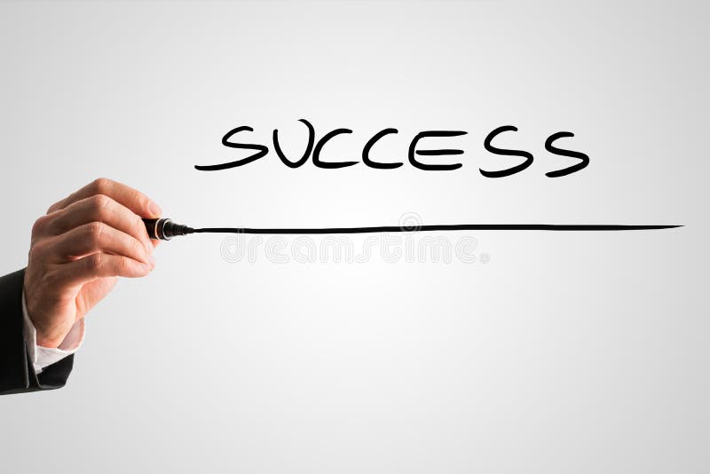 Man writing the word - SUCCESS - with a black marker pen from be royalty free stock image