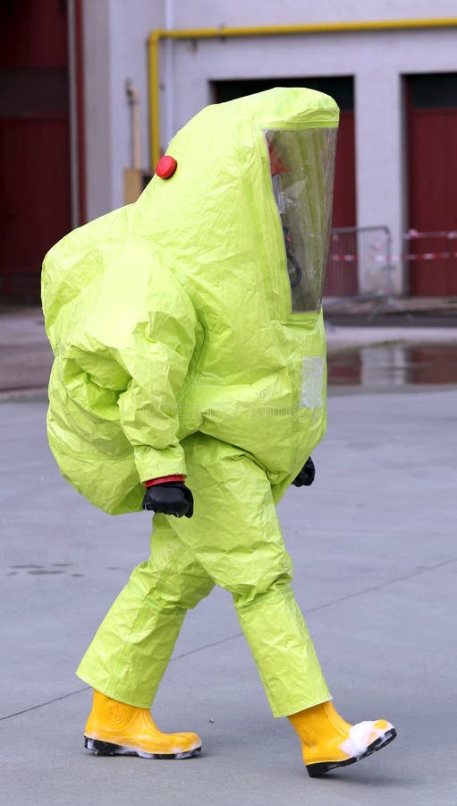 Man with yellow protective suit against biological risk. 