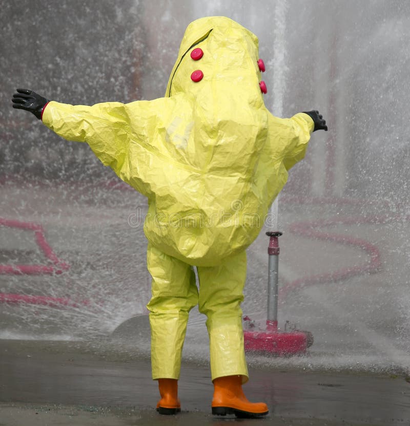 Man with Yellow Protective Suit with Air Filtering System Stock Photo