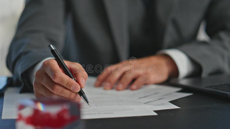 Manager hands writing report with pen closeup. Busy worker browsing computer stock image