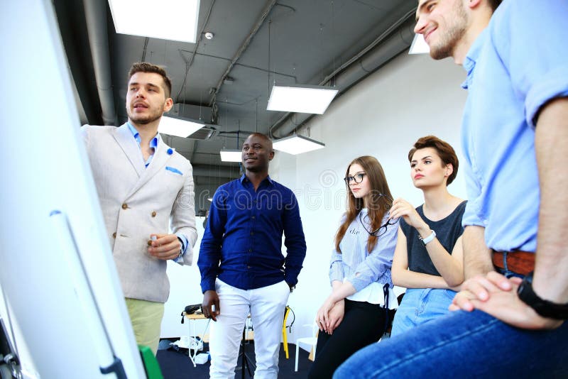 Manager Leading Creative Brainstorming Meeting In Office. stock photos Manager Leading Creative Brainstorming Meeting In Office. stock photos