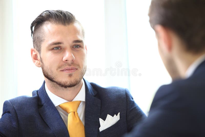 Manager listening to his colleague explanations