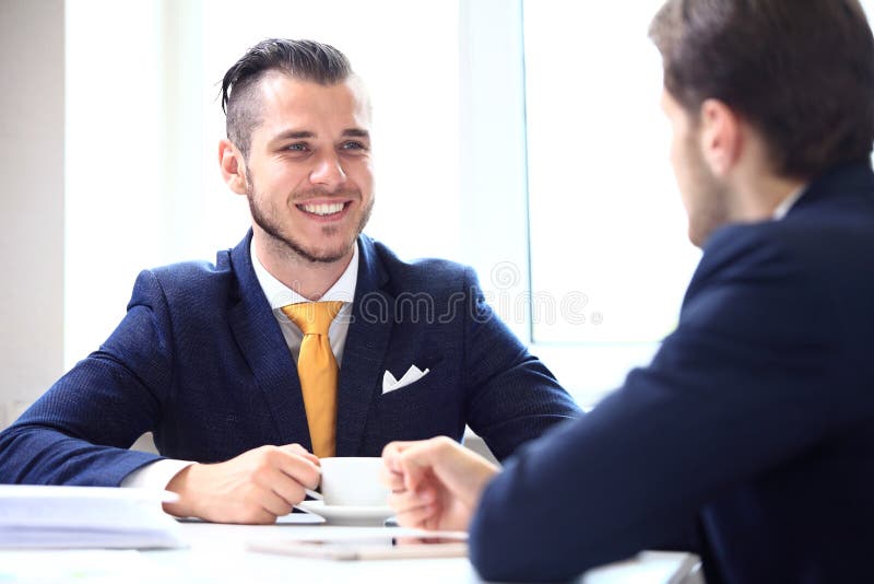 Manager listening to his colleague explanations