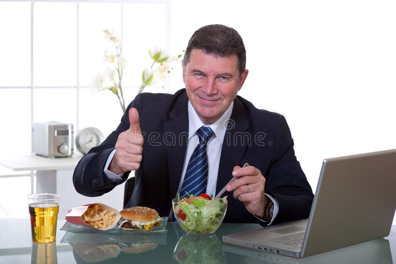 Manager at office thumb up eat green salad healty food. Manager at office thumb up eat green salad healty food