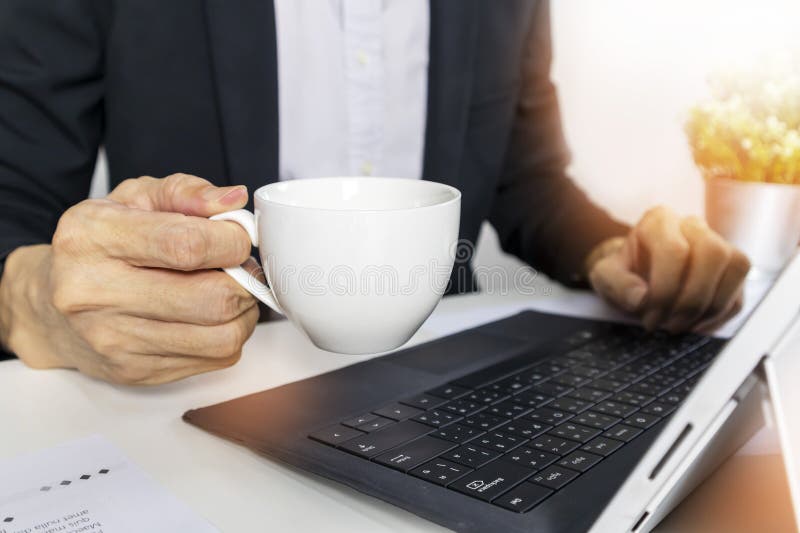 Manager in office grabbing morning coffee, starting work in the morning and new ideas for work royalty free stock photos