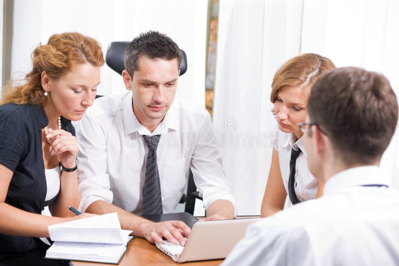 Manager with office workers on meeting