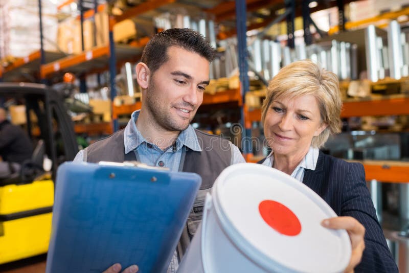 Manager showing inventory worker type product royalty free stock photo