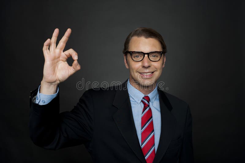 Manager showing okay sign to camera, good work royalty free stock images