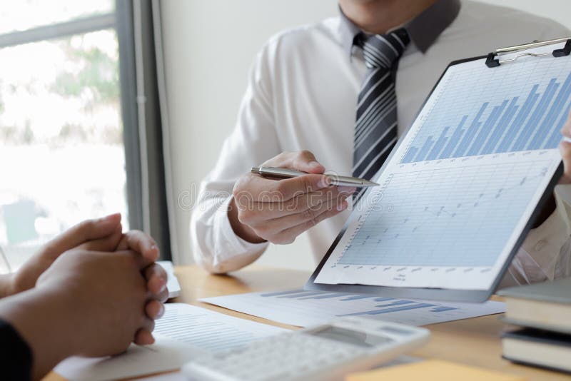 Managers and accountants have checked the company`s finances. In order to prepare the performance measurement for the past 5 year stock photography Managers and accountants have checked the company`s finances. In order to prepare the performance measurement for the past 5 year stock photography