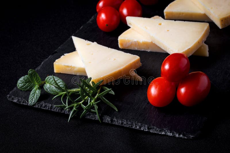 Manchego Cheese with Grapes, Mint and Rosemary Stock Photo Image of
