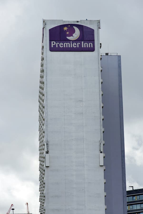 MANCHESTER, UK - AUGUST 10, 2018: Premier Inn Manchester hotel exterior view. It is the largest hotel chain in the UK with 50,000 rooms in 650 hotels. MANCHESTER, UK - AUGUST 10, 2018: Premier Inn Manchester hotel exterior view. It is the largest hotel chain in the UK with 50,000 rooms in 650 hotels