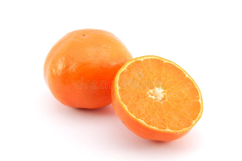 A cut mandarin orange isolated on white. A cut mandarin orange isolated on white