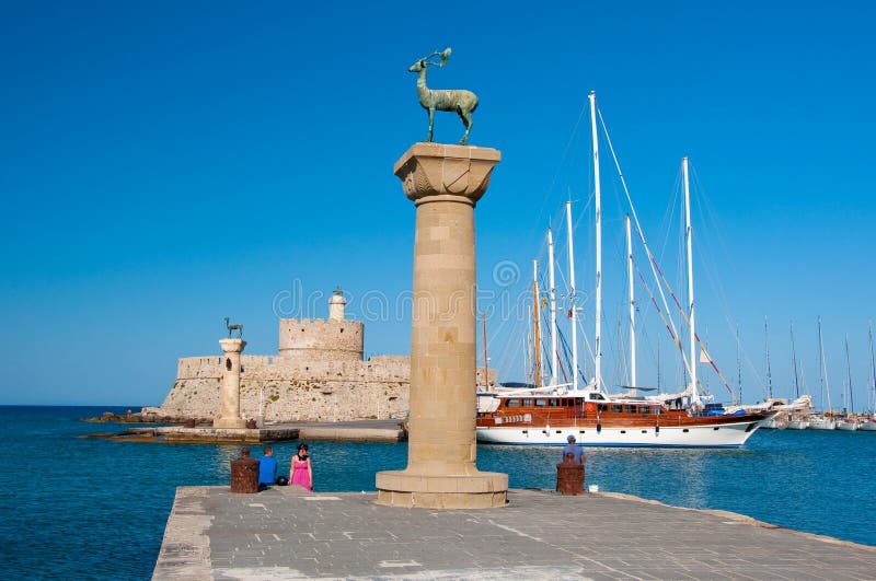Mandraki harbor and bronze deer statues, Greece