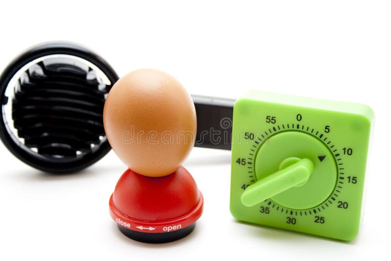 Eggs mandrel with egg and time Scolding clock as well as egg slicer. Eggs mandrel with egg and time Scolding clock as well as egg slicer