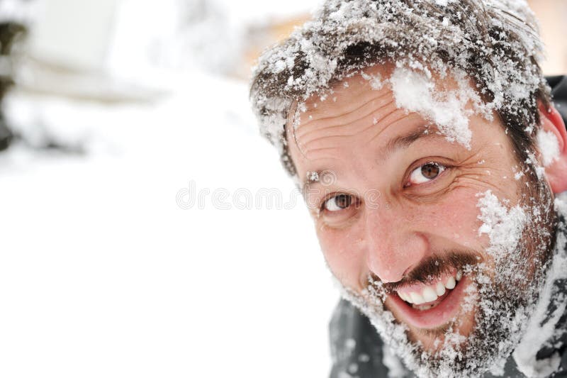 Manen i snow, vänder mot gyckel arkivbilder Manen i snow, vänder mot gyckel arkivbilder