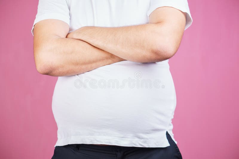 Manger avec excès, nourriture industrielle Homme obèse avec le grand ventre photo libre de droits Manger avec excès, nourriture industrielle Homme obèse avec le grand ventre photo libre de droits