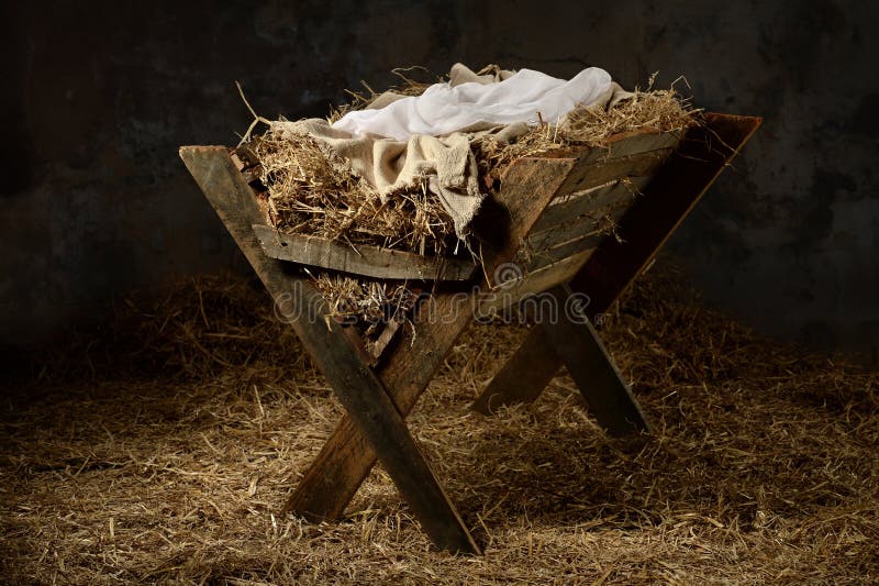 Manger with hay and swaddling clothes in old stable. Manger with hay and swaddling clothes in old stable