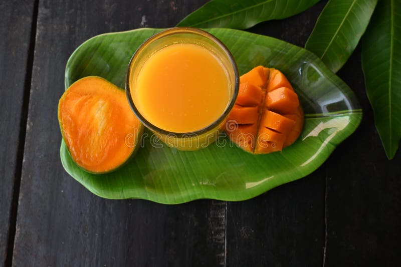 Mango Juice with Mango Slice Isolated on Black Background. Stock Image