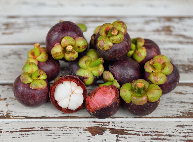 Mangosteen, Fruit and Cross Section Showing the Thick Purple Skin and