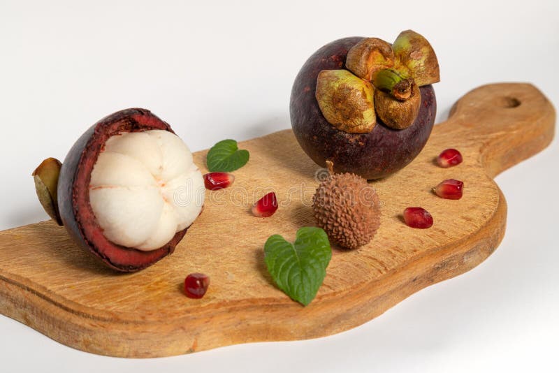 Mangosteen And Lychee On A Wooden Tray On White Background Stock