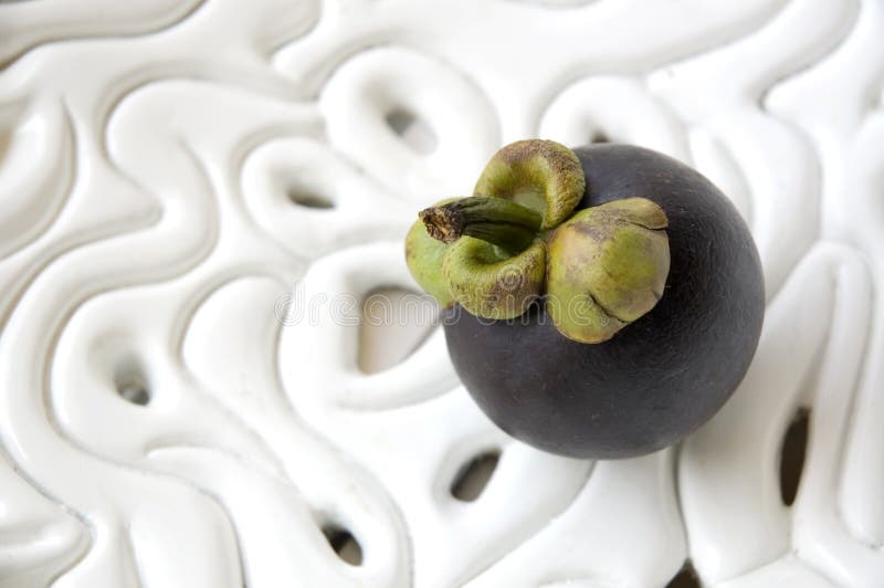 Mangosteen on white bowl