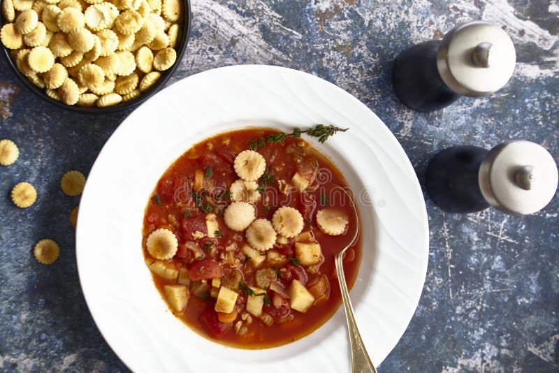 Manhattan Clam Chowder with Oyster crackers on a Flat Lay