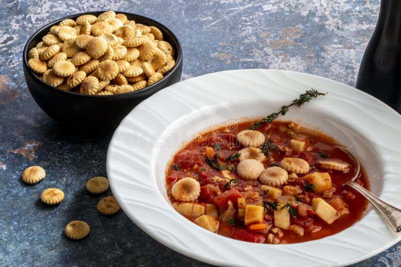 Manhattan Clam Chowder with Oyster crackers on a Flat Lay