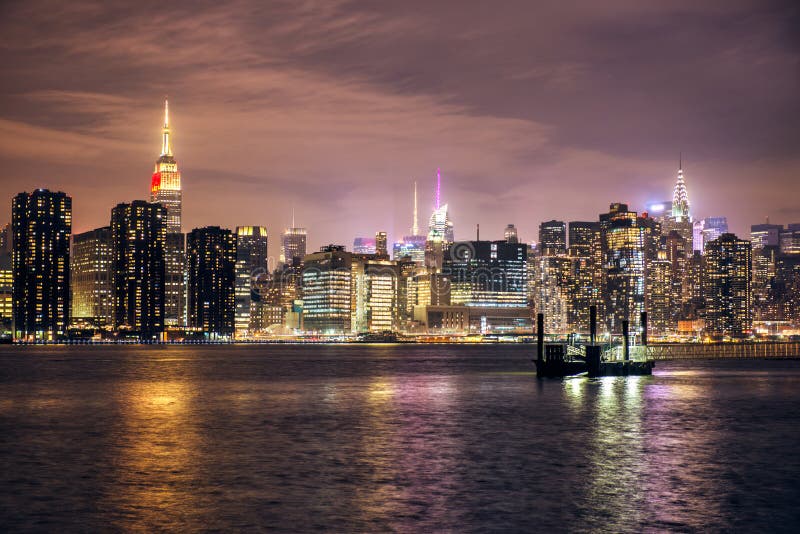 Manhattan midtown skyline with skyscrapers buildings at night, New York City stock photography Manhattan midtown skyline with skyscrapers buildings at night, New York City stock photography