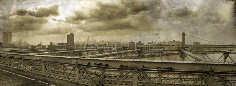 Panoramic view of Manhattan taken from the Brooklyn bridge, on grunge sepia background. Panoramic view of Manhattan taken from the Brooklyn bridge, on grunge sepia background.