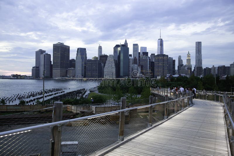 New York Manhattan from Brooklyn Squibb Park Bridge. A pedestrian bridge connects Brooklyn Heights with the Pier 1 section of Brooklyn Bridge Park. New York is the most populous city in the United States, and the center of the New York metropolitan area, which is one of the most populous metropolitan areas in the world. A leading global city, New York exerts a powerful influence over global commerce, finance, media, culture, art, fashion, research, education, and entertainment. As host of the United Nations Headquarters, it is also an important center for international affairs. The city is often referred to as New York City or the City of New York to distinguish it from the state of New York, of which it is a part. New York Manhattan from Brooklyn Squibb Park Bridge. A pedestrian bridge connects Brooklyn Heights with the Pier 1 section of Brooklyn Bridge Park. New York is the most populous city in the United States, and the center of the New York metropolitan area, which is one of the most populous metropolitan areas in the world. A leading global city, New York exerts a powerful influence over global commerce, finance, media, culture, art, fashion, research, education, and entertainment. As host of the United Nations Headquarters, it is also an important center for international affairs. The city is often referred to as New York City or the City of New York to distinguish it from the state of New York, of which it is a part.