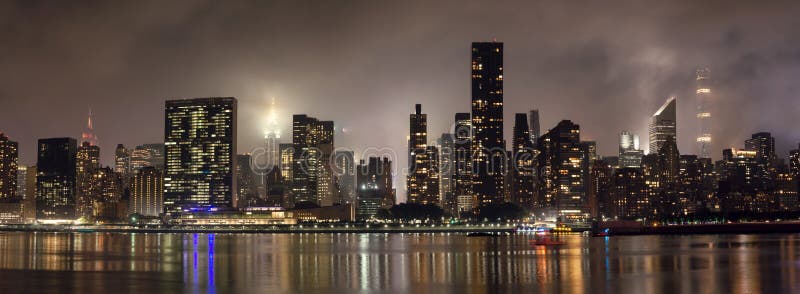 Manhattan skyline at night with reflections, NYC, USA. royalty free stock image Manhattan skyline at night with reflections, NYC, USA. royalty free stock image