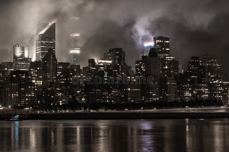 Manhattan skyline at night with reflections, NYC, USA. royalty free stock images Manhattan skyline at night with reflections, NYC, USA. royalty free stock images