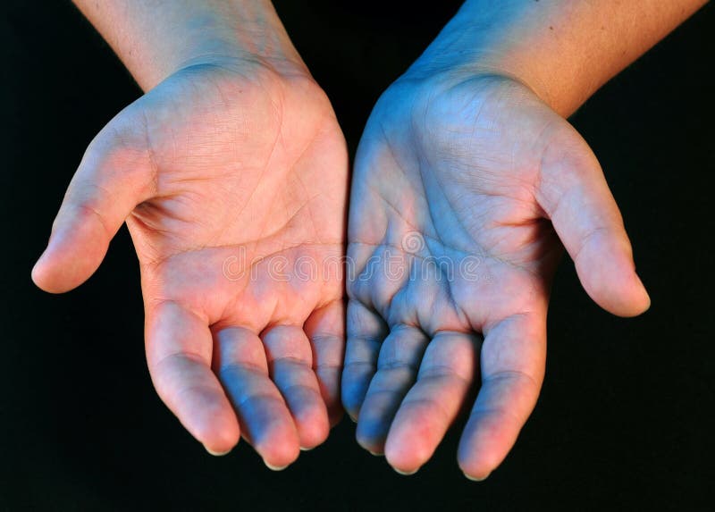 A view with hands over black. A view with hands over black