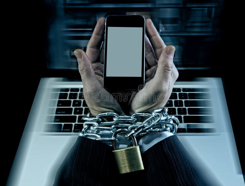 Hands of caucasian businessman addicted to mobile phone bond and locked with iron chain wrists in smartphone internet addiction and slave to online network addict concept. Hands of caucasian businessman addicted to mobile phone bond and locked with iron chain wrists in smartphone internet addiction and slave to online network addict concept