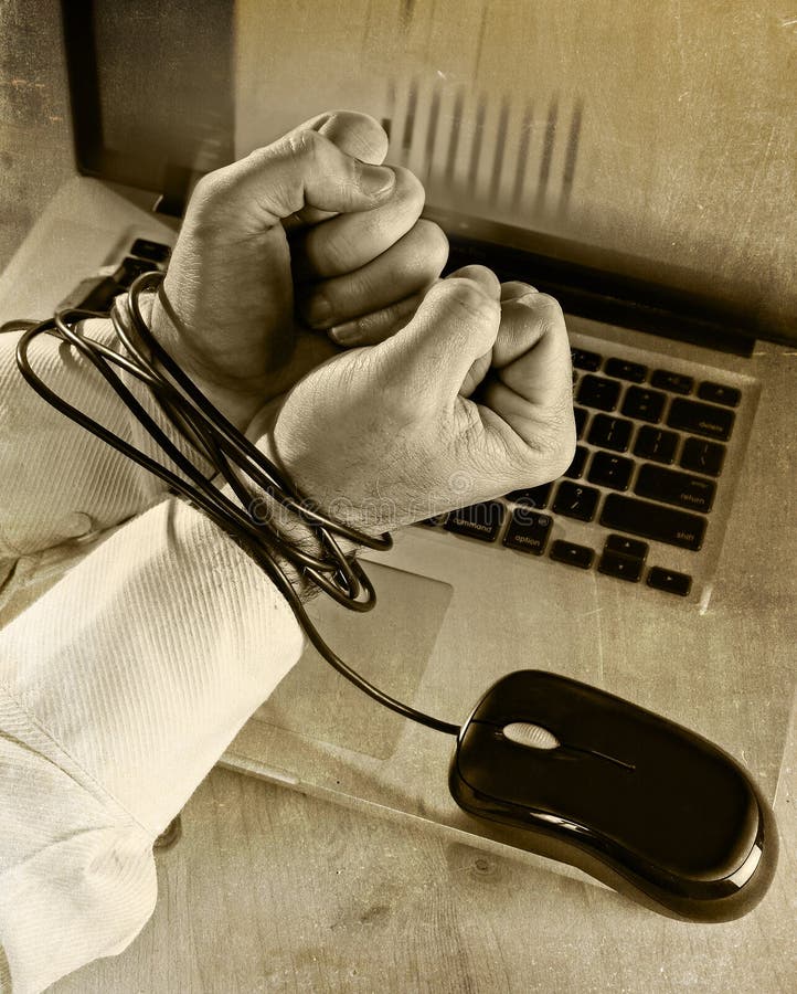 Hands of caucasian businessman addicted to work tied and bond with computer mouse handcuffed with laptop in workaholic, internet slave and addict concept black and white. Hands of caucasian businessman addicted to work tied and bond with computer mouse handcuffed with laptop in workaholic, internet slave and addict concept black and white