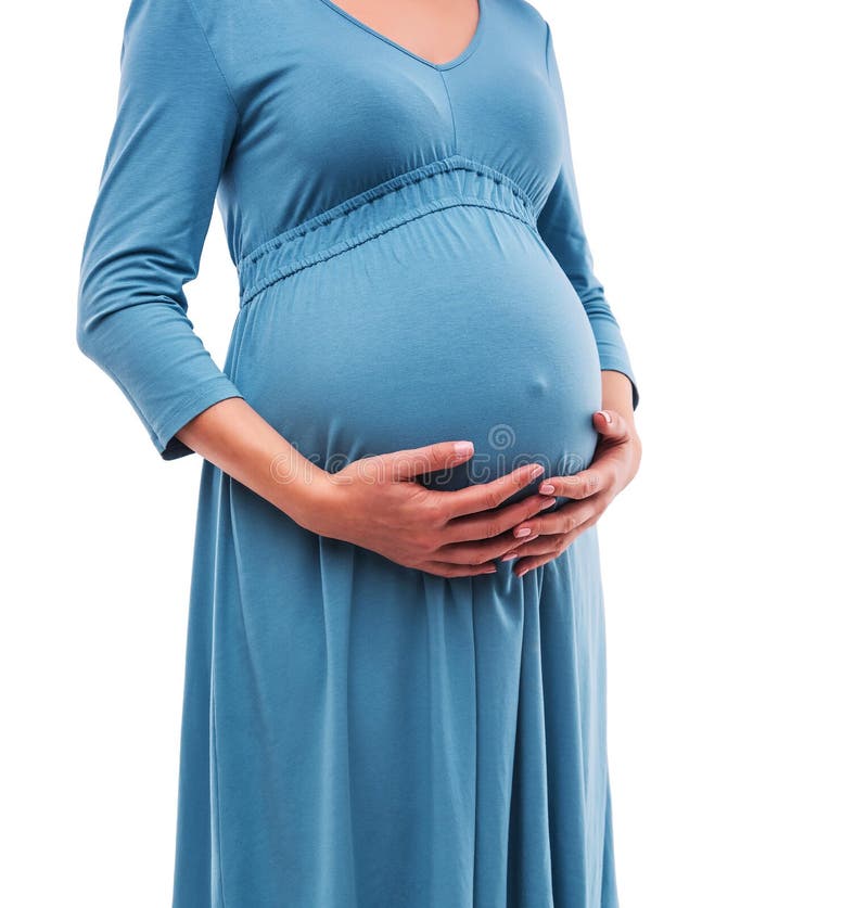 Mani della stretta della donna incinta sulla pancia Primo piano immagini stock Mani della stretta della donna incinta sulla pancia Primo piano immagini stock
