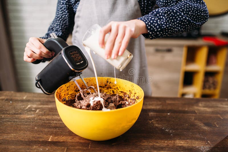 Female person hands mixing cake ingredients. Tasty dessert homemade cooking. Female person hands mixing cake ingredients. Tasty dessert homemade cooking