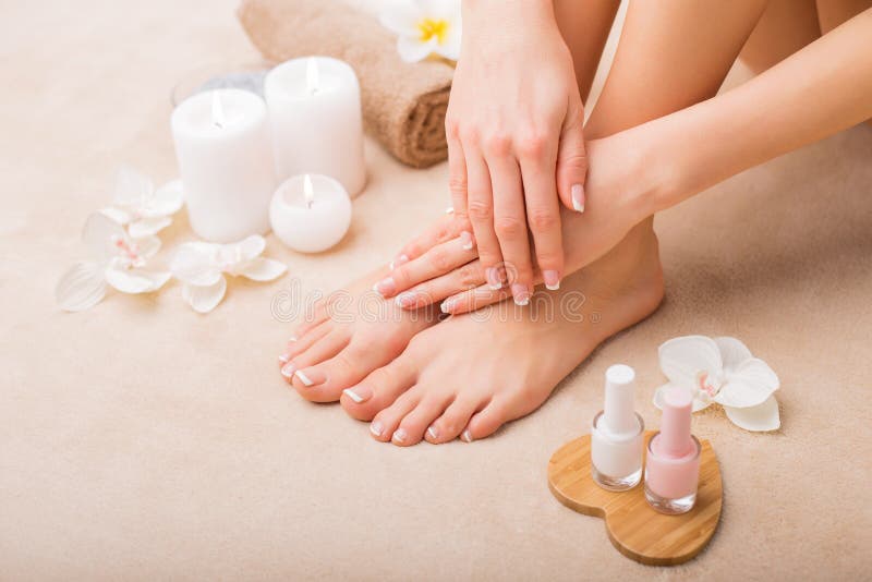 Female with French manicure and pedicure. Female with French manicure and pedicure