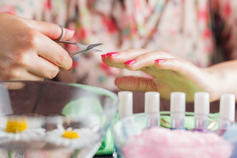 Manicure Applying, Cutting the Cuticle with Scissors Stock Photo