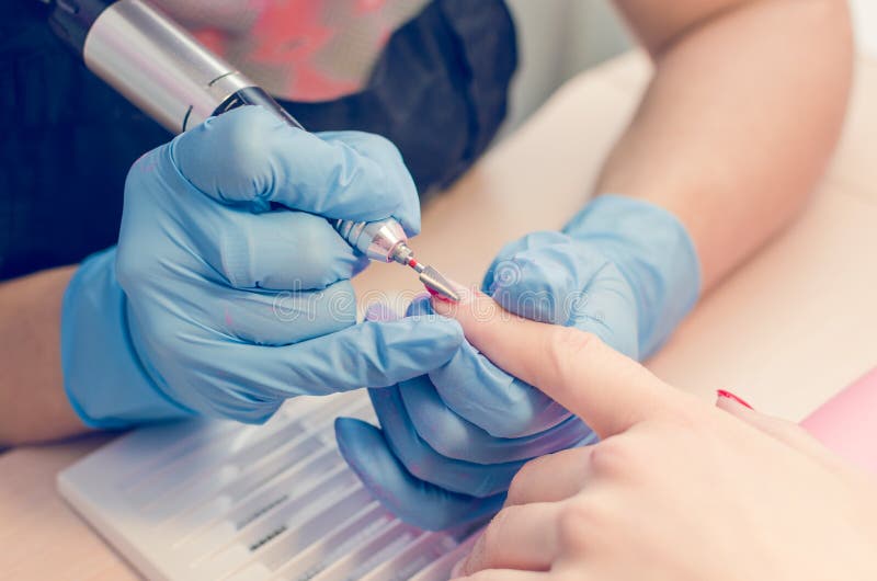 Manicure Process, Cleaning of Nails by a Milling Cutter Stock Image