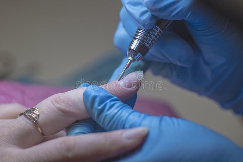 Manicure Process, Cleaning of Nails by a Milling Cutter. Stock Image